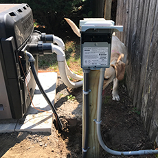 Electrical work for disconnect and pool heater, including electrical box on post.